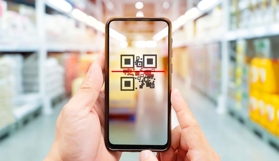 A person using a smartphone to scan a QR code to access product information. Symbolizing intelligent media.