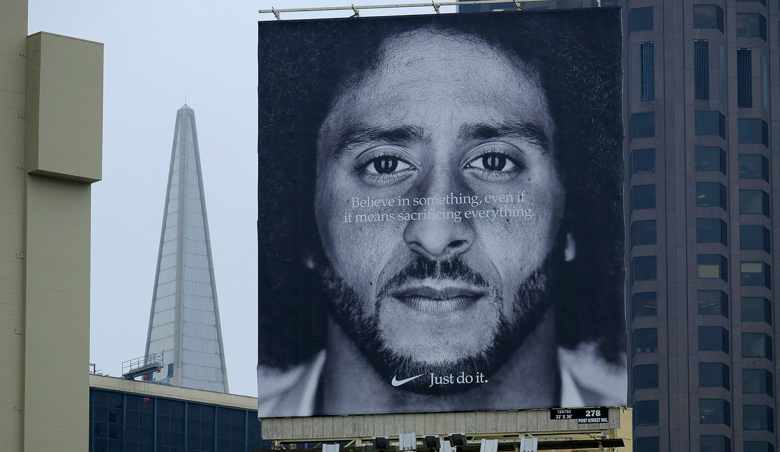 A giant billboard Nike ad featuring the face of kneeling quarterback Colin Kaepernick with the text, “Believe in something, even if it means sacrificing everything. Just do it.” Source: The New York Times.